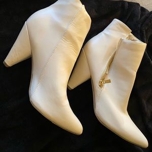Heeled white booties